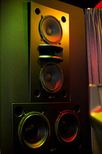 Black Augspurger Duo-15 Speaker System front view in music studio.